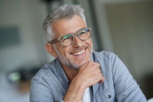 Terry smiling about having a new dental implant