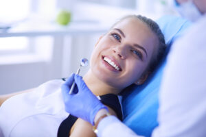Nervous Dental Patient Edgware - woman sitting in the dentist chair smiling